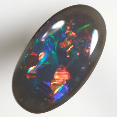 SOLID BLACK OPAL Flag Harlequin pattern. Sparkles of very bright fire red multicolour